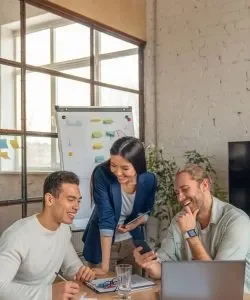 vertical-shot-of-multiracial-business-people-with-laptop-and-smartphone-having-meeting-in-office--qywxxzxohy5j1wc7zeyec9d2jxejaxxi2kwdo1uss8_11zon